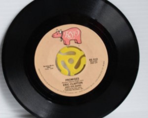 This late-1978 RSO single by Eric Clapton is shown with a 45 adapter.
